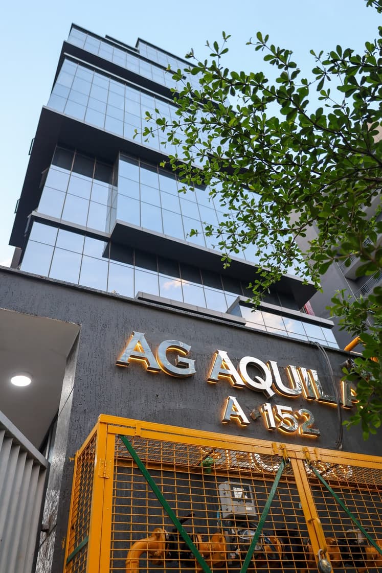 Aquila Grand Suite exterior at dusk.