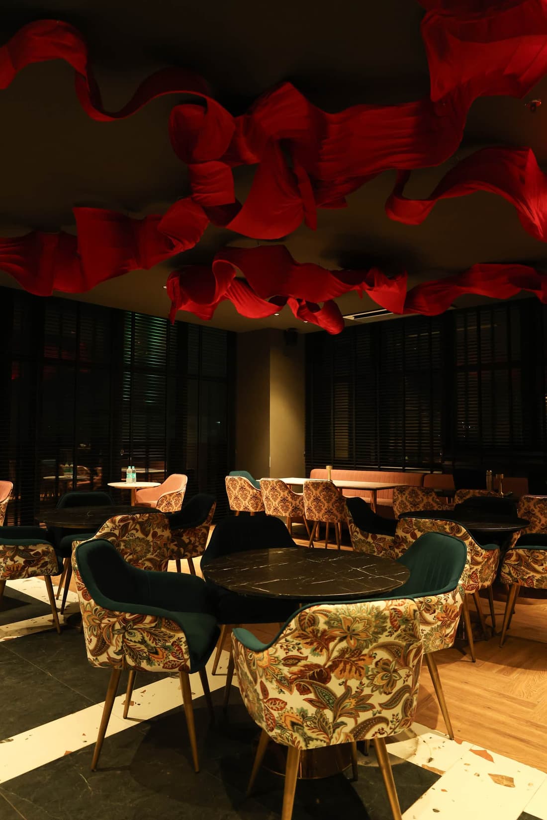 Aquila Grand Suite lounge with warm ambient lighting.